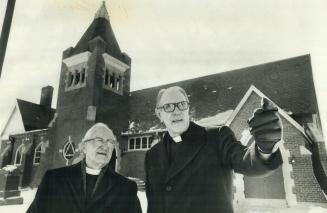 The 150-year history of St. Philip's Church is discussed by its present pastor, Canon Arthur Chote (right), and Rev. Thomas Butler, 88, who was pastor(...)
