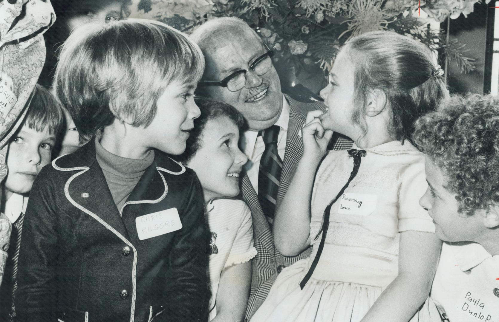 Look, no cavities: Seven-year-old Rosemary Leach shows Dr. Stewart MacGregor and other young former patients how he kept her teeth in good shape. The (...)