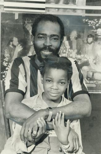 Her mother doesn't want her, says music store owner Oswald Creary as he holds 9-year-old Joan Livermore who was ordered deported to Jamaica.Creary, wh(...)