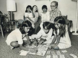 University professor Leo Johnson and Carolyn Mosher, whom he plans to marry, are seen with the five children he hopes to adopt. They are the children (...)