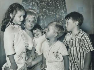 Waiting to be deported after she stole some clothing for her children, Mrs