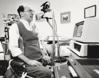 Lewis Boles, 38, a quadriplegic who, since 1971, has lived at the Queen Elizabeth Hospital, works part time on an IBM PC-XT computer specially adapted with a voice recognition system