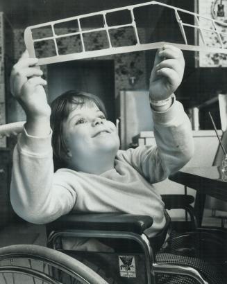 Young paraplegic Aaron Smith does not let confinement to a wheelchair with his love of hobbies and sports
