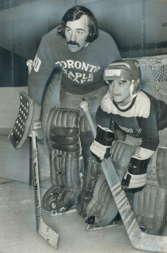 Who's the pupil? Maple Leaf goalie Ron Low may be taking a few pointers from Ricky Ware, Timmy for 1973, at Leafs' practice at Gardens yesterday after(...)