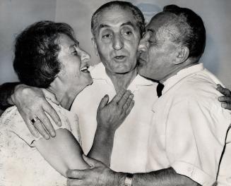 Maurice Stern and his sister, Mrs. Philip Greenspan, are re-united with their brother from Brazil, Jonas Stern, centre, after being separated for fifty years