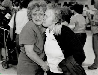 A Long Goodbye: Ann Hynds, left, of Kincardine hugs her sister Myroslawa masio, set to return to Ukraine, at Pearson airport yesterday
