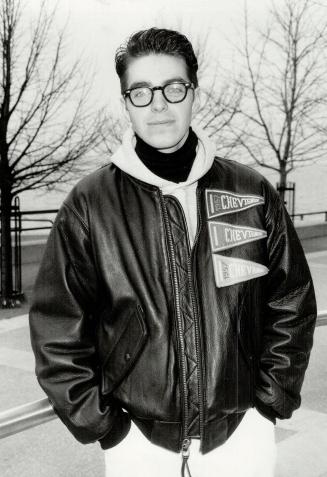 fashion desinger Dan Caten wears his collegiate-look, black framed glasses strictly as an accessory