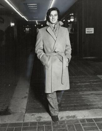 Wrapped luxury: Left, Toronto designer Gerald Franklin models cashmere camel coat ($1,200)
