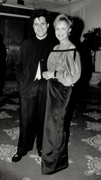 Left, designer Isaac Mizrahi with retailer Sharon Batten in one of his designs