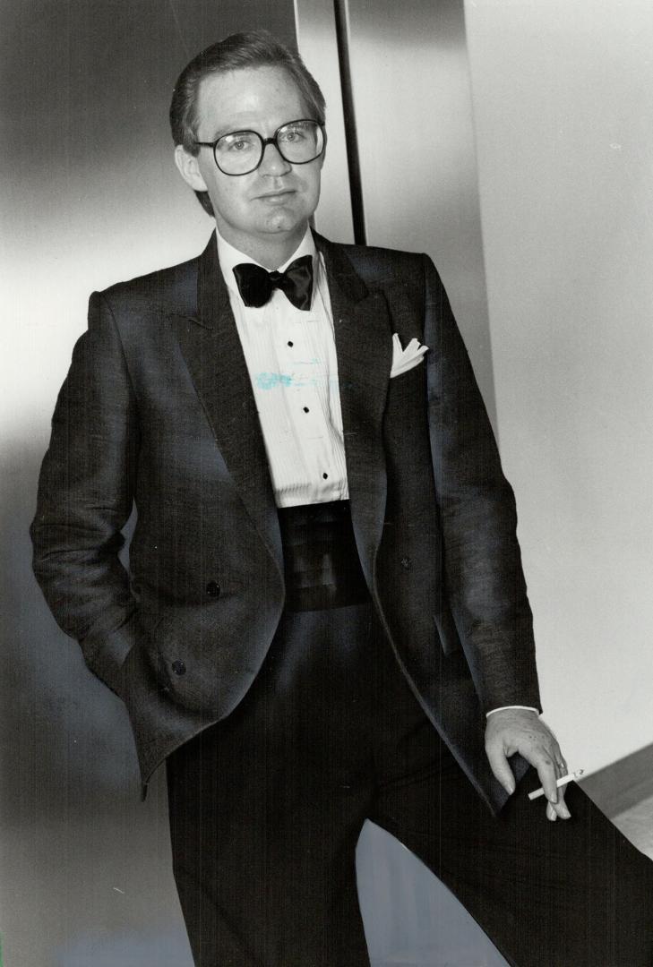 Elegant style: Bernard McGee wears a raw silk tuxedo, above, in charcoal gray with black pants