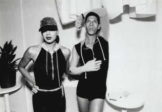 At the Go Go Club, designer Keith Richardson and editor Suzanne Boyd, right, are in complementary hooded unitards designed by Richardson