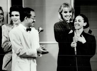 The winner: Alfred Sung Presents the Clairol Fashion Award to Montreal designer Claire Belzil, whose long, full coats (top right) impressed all
