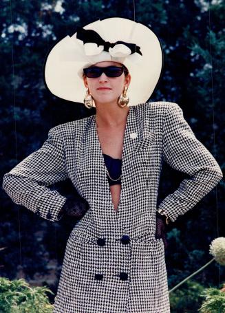 Toronto fashion designer Lee Buchanan wore a racy black bustier, net gloves and chic Euro-fashion shades to dress up her houndstooth jacket and Eric Javits hat