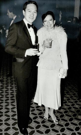 Left, Toronto designer Vivien Poy, with husband Dr. Neville Poy