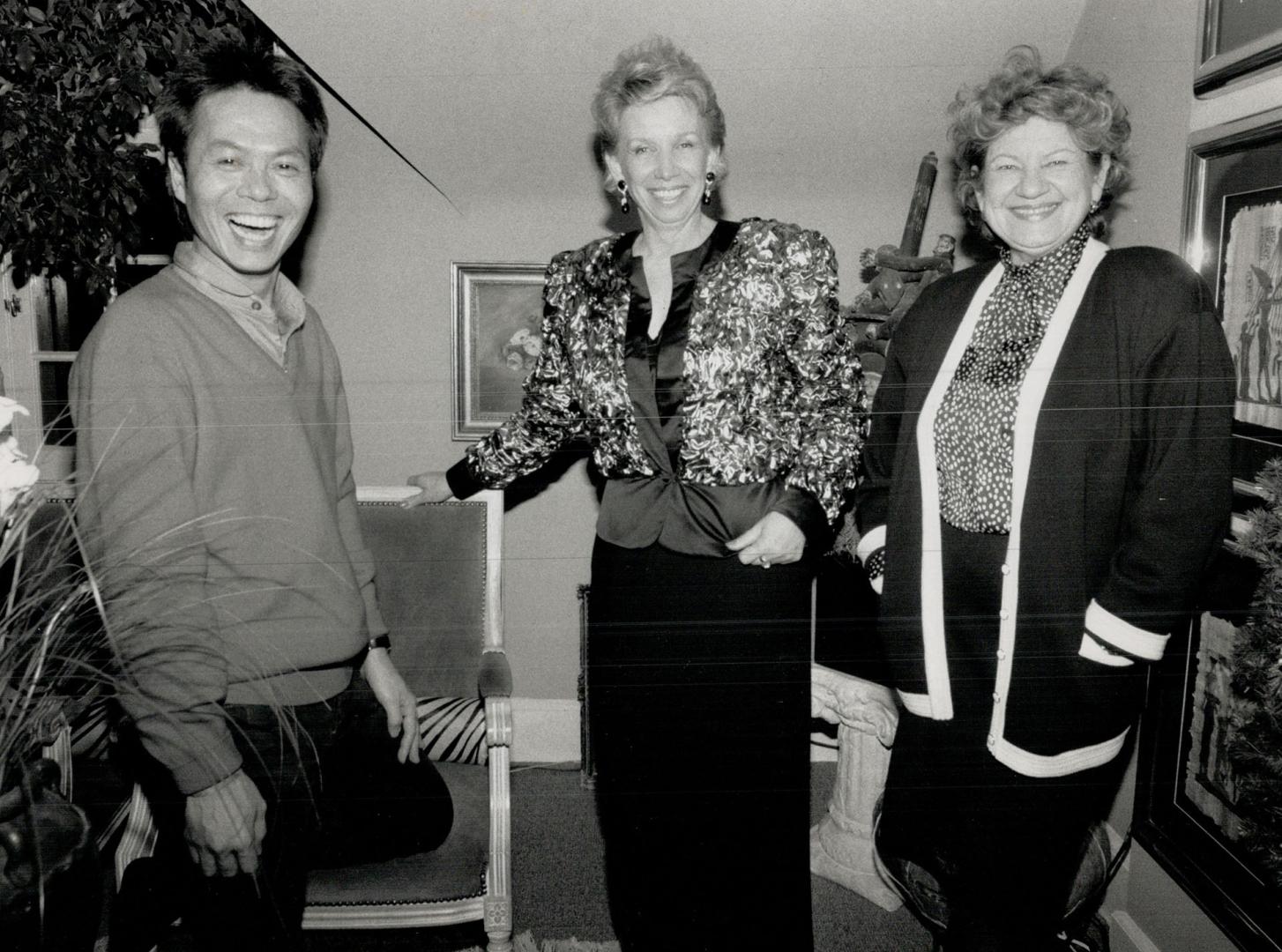 Above, from left, Peter Lam, with children's wear designer Elvira Valli, and Ann Ciona in a wool crepe evening skirt, and iridescent crinkle evening jacket of her design
