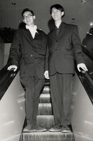 Fashion Designers Eduardo Wong in an outfit of his own design, and Tu Ly in Yohji Yamamoto jodhpur suit