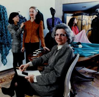 Zoe, who opened her first couture salon in Toronto in 1960, directs the fitting of a suit with assistant Jasmine King on client Robin Vaile at her Scollard St. boutique