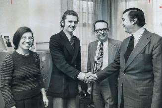His dream of freedom in Canada realized, deaf mute Bogdan Czerniawski, 25, (second from left), is welcomed by Immigration Minister Robert Andras (righ(...)
