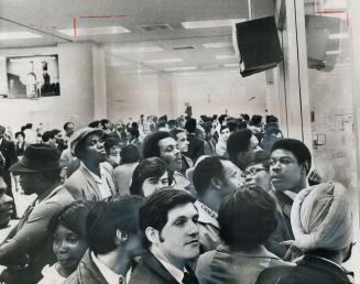 Almost Two Hours after a flight from Jamaica arrived, friends and relatives meeting the passengers crowd the waiting room. Non-Canadian passengers on (...)