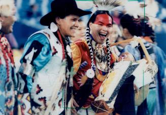 Noodin-Nimebin Shawanda, 3 months, sleeps as dad Maheengun Shawanda wins Canadian Aboriginal dance contest at Sky Dome yesterday