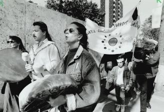 Marching to Different Drummers, From left, Lorna Dennis, John Poulette and Jo-Anne Miller lead the way down Parliament St. toward Queen St. E. yesterd(...)