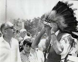 Mississauga Chief Fred King adjusts his bonnet as he chats with Mississauga mayor Robert Speck