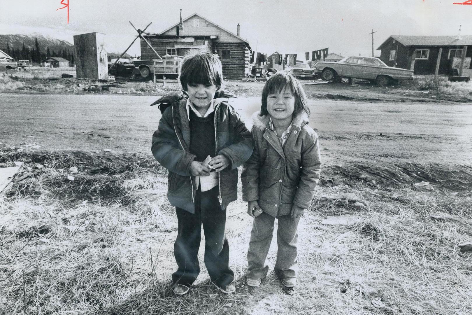 In an Indian village on the outskirts of Whitehorse, Darryl Charlie, 6, and his cousin Jacky Charlie, 5, smile at strangers - but the mood in the Yuko(...)