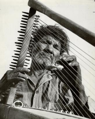 This looks like a section of telegraph wires, but it's a harp played by one of those curious Mexican Indians, the Yaquis