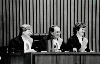 Sworn Smiles: Judge Mary F. Dunbar, right, and Judge Marion E. Lane flank Judge Donald August, regional senior judge of the Ontario Court of Justice, (...)
