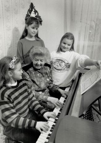 Musical teacher: Florence Adams, 75, with her students (from left) Martina, 8, Larissa, 12, and Sonja Kilian, 9