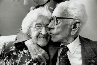 Birthday kiss for sis, Edna Carely, who turned 100 yesterday, gets a birthday kiss her kid brother Olli, 98, Edna, who lives in Fellowship Towers, a T(...)