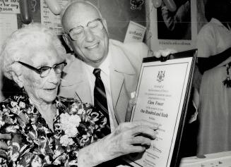 Happy 106th birthday, Clara, Clara Fraser shows son Walter, 76, the plaque sent to her by Premier David Peterson in honor of her 106th birthday yester(...)
