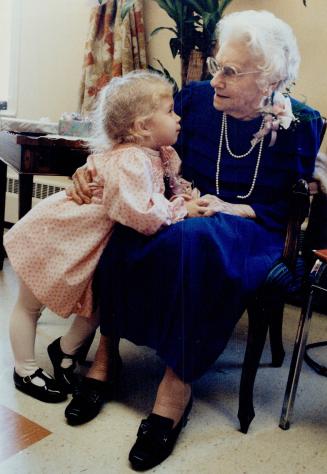 Happy 100th, Great-Grandma, Three-year-old Cealiea Hope leans over to chat to her great-grandmother, Alice Hope, yesterday at a 100th birthday party f(...)