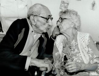 A happy 104th birthday kiss, Zabelle Gumachkerdan puckers up for a kiss from husband Herant yesterday, as she celebrates her 104th birthday at Castlev(...)