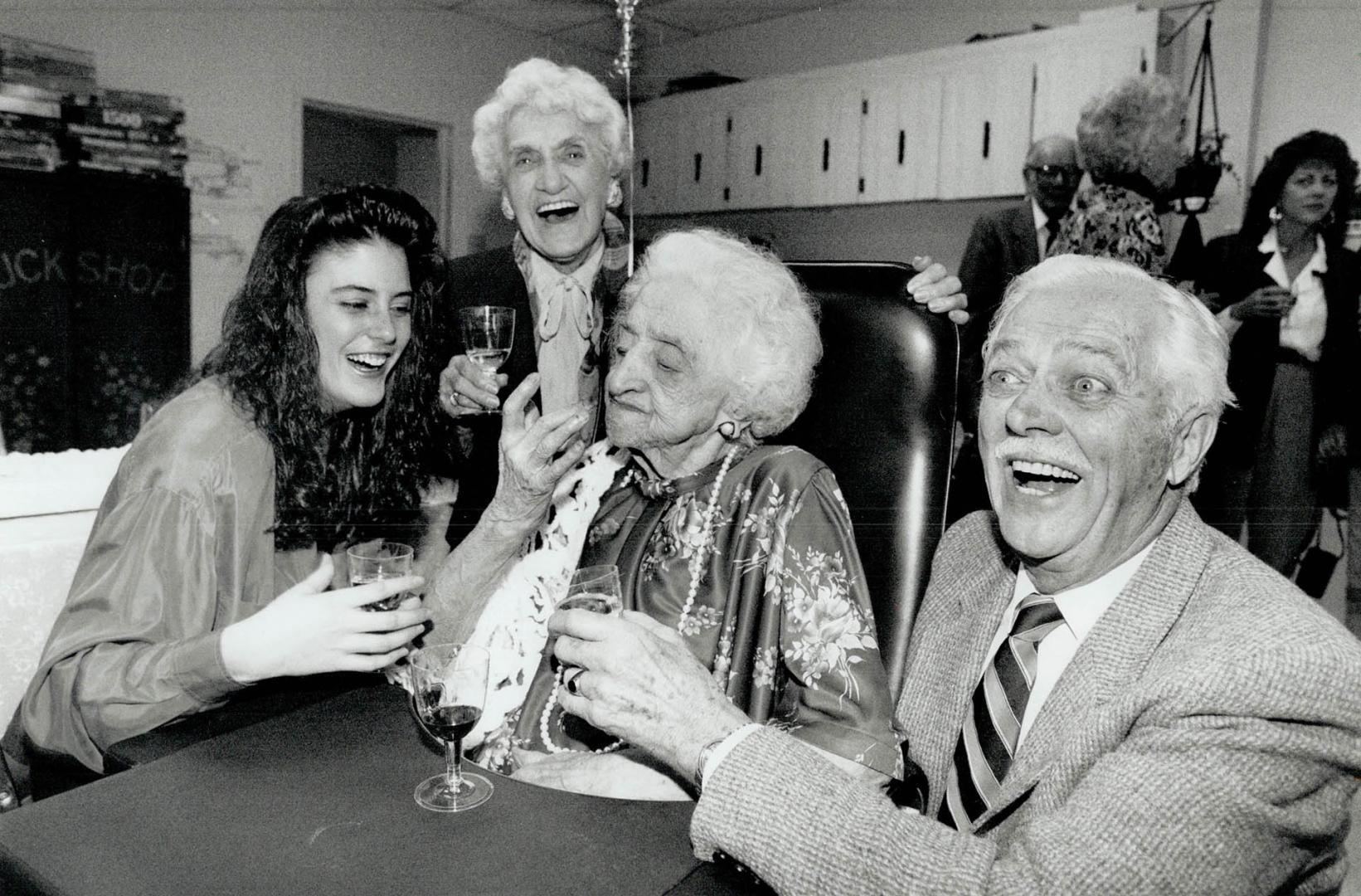 A very good year, Mabel Lewis celebrates her 100th birthday with a glass of fine sherry in the company of great-granddaughter Carrie Bennett, 17, youn(...)