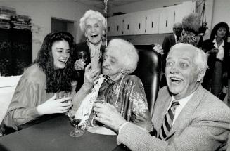 A very good year, Mabel Lewis celebrates her 100th birthday with a glass of fine sherry in the company of great-granddaughter Carrie Bennett, 17, youn(...)