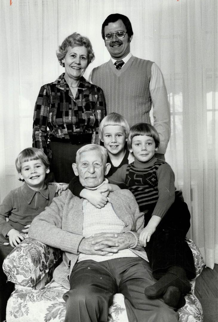Happy 100, John Kennedy of Willowdale gets happy 100th birthday wishes yesterday from three generations: His daughter Mary Kenney, her son Don, and his sons (from left), Glenn, John and Darren
