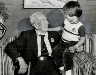 Autumn, Ming-Lam Ma, 102, chats with Stephen Wong, 3, at the Mong Sheong Home for the Aged on D'Arcy St