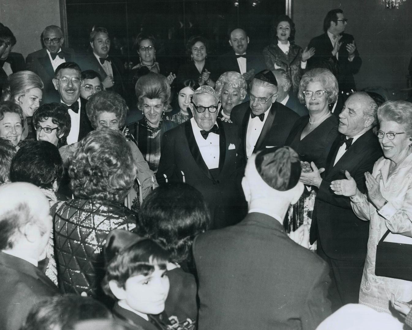 Echiel Silverman, centre, a retired tailor, celebrated his 100th birthday Saturday night at a dinner and dance for 300 relatives and friends gathered at the Adath Israel Congregation in Downsview