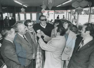 A $136,000 winner on the Lincolnshire Handicap sweepstakes on Saturday, Bob Allan (centre) in dark coat and glasses, celebrates the good news in his P(...)
