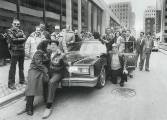 Lotto-winning police arrive in style, Twenty Metro police officers and civilian clerk Lottie Schran arrived in limousines today at Lotto 6/49 headquar(...)