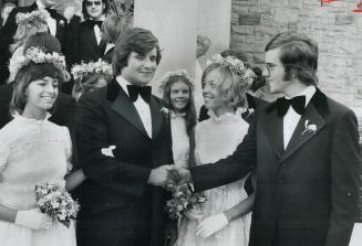 Very new newlyweds George and Joanne Mary Baker (left) are congratulated by the groom's younger brother Robert and his wife Susan. The George Bakers w(...)