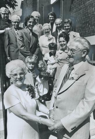 Wedding bells ring at 70, Alfreda Brunning, 70, of Toronto, and her bridegroom, Harry Lapp, also 70, of Philadelphia, pose on the steps of Crawford St(...)