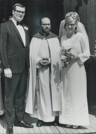 Bride makes dad's vestments, Mrs. Smith, the former Marie Sarty, and her husband were married at St. Mark's Anglican Church on Cowan Ave. by Rev. Graham Cotter, Mrs. Smith's foster father