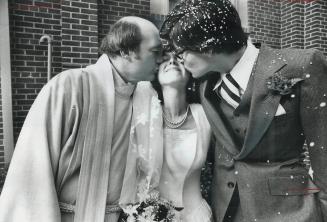 Trusty kisses, Rev. William Davis and the bridegroom, fellow Scarborough school trustee Joe Turner, kiss the bride, Janine Suter, after Davis married (...)