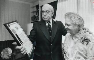 60th anniversary, Godfrey and Adele Berner look at a plaque from Premier William Davis congratulating them on their 60th wedding anniversary. The Etob(...)