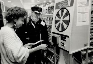 Wheel-Watchers: People are lining up daily to try their luck at the five computer game machines at North York's Madison Centre