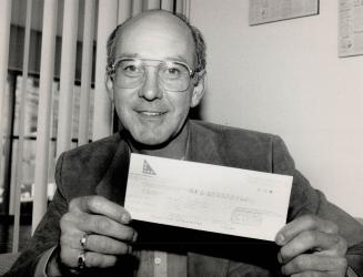 One happy man, Arthur Lachapelle of Ottawa, a self-employed carpenter and father of two children, is delighted with a cheque for $3.3 million ? his share of a Lotto 6/49 draw