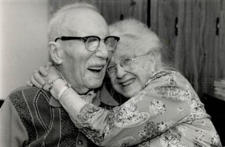 William E. Francis, 99, and his wife, Beatrice, 96, still embrace after a life-time together. They married in 1913