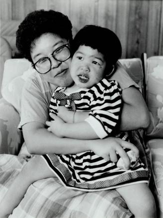 Mother's love: Louise Cheung, with Stephanie, 2 1/2, has formed a Canadian chapter of the Tuberous Scierosis Society